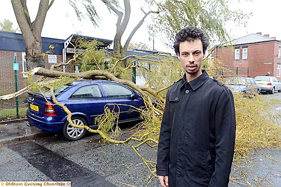 COUNTING the cost . . .Adrian and the large branch that crashed down on his car during the height of yesterday’s gales