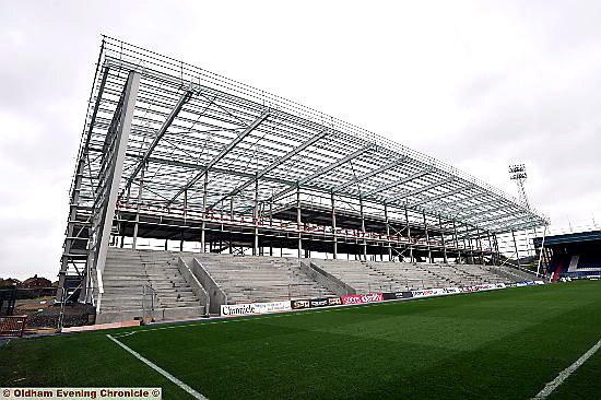 LOOKING GOOD: the new Athletic stand is on course to be completed for the start of next season as our reporter Matthew Chambers (inset) finds out from Paul Whitehead, managing director of Holroy Developments. 