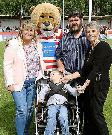 WINNING team: With mascot Roary and Joe Joe are (from left) aunt Andrea McKenna, dad Billy Atherton and grandmother Marilyn Atherton