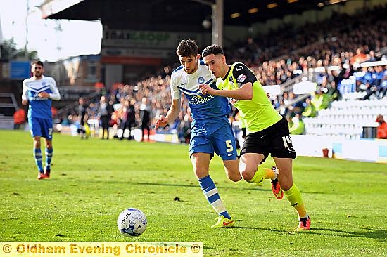 FORWARD CHARGE . . . Athletic striker Conor Wilkinson makes his presence felt.