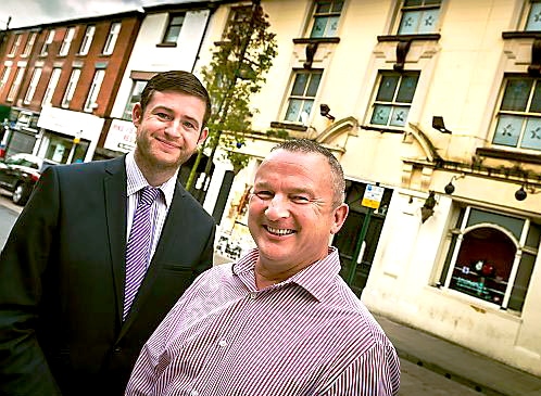 STEP back in time: the iconic Grapes Hotel will soon be resurrected. Council leader Jim McMahon is pictured with Guy Barlow in the Independent Quarter