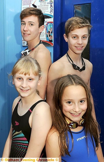 STRONGER TOGETHER: rear, l-r - Liam Burston (Captain of Royton) and Callum Andrew (Captain of Crompton). Front, Junior members Ella Price (Royton) and Libby Royle (Crompton).