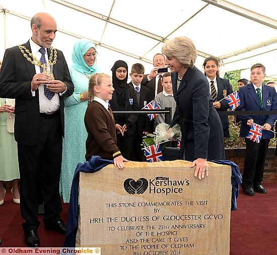 PROUD moment: the duchess unveils a special commemorative stone