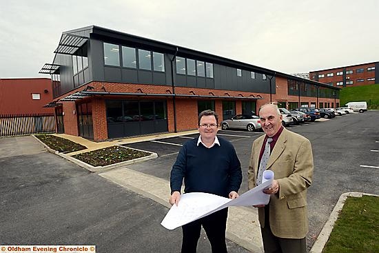 MOVING in: Managing director Aidan Towey (left) and chairman David Bellis study plans for the internal layout of the new building.