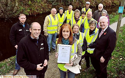 Street Scene Greenfield received the volunteer of the year award from the Canal and River Trust. Pictured (front L-R): David Baldacchino and Gill McCulley (Street Scene Greenfield group leader) with volunteers