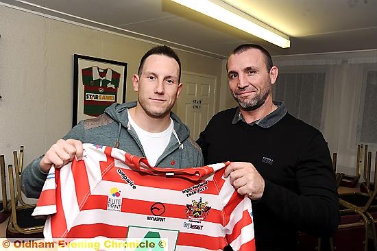 BACK IN THE GAME . . . new signing Adam Neal (left) receives a warm welcome from Scott Naylor. 