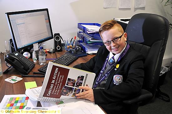 MAKING decisions . . . Callum Turley (13) takes over the role of head teacher at Newman College