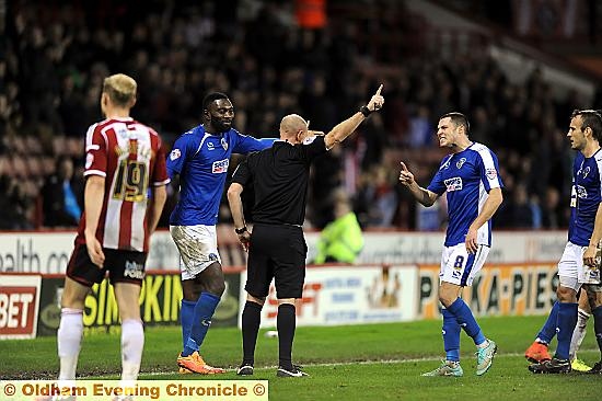 MARCHING ORDERS . . . Mike Jones (right) gets his point across as referee Andy Davies dismisses Athletic front man Jabo Ibehre. 