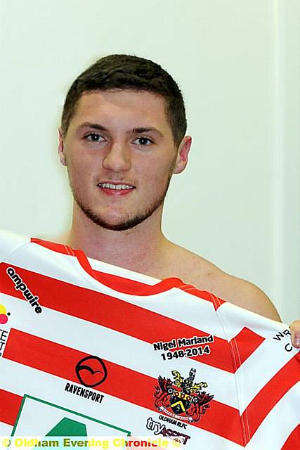 SIGNED UP: new boy Jack Holmes shows off his Oldham jersey.