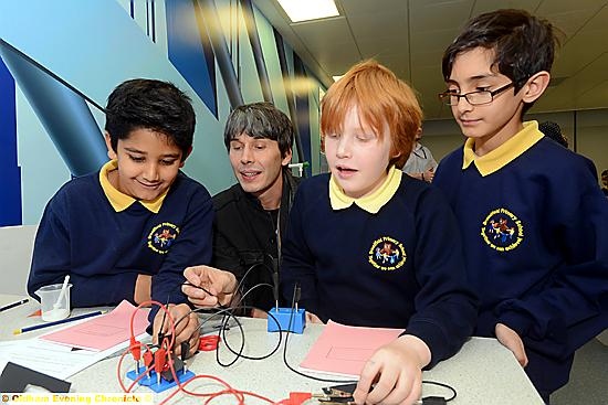 FANTASTIC science: Brian Cox with Broadfield Primary School pupils , from left, Ibrahim Jamroze, Lucas Tierney and Jameel Yaseen. 