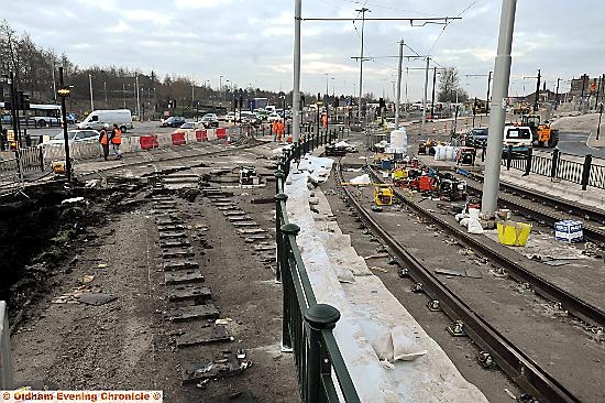 The scene this morning as workmen connected the town-centre tracks 

