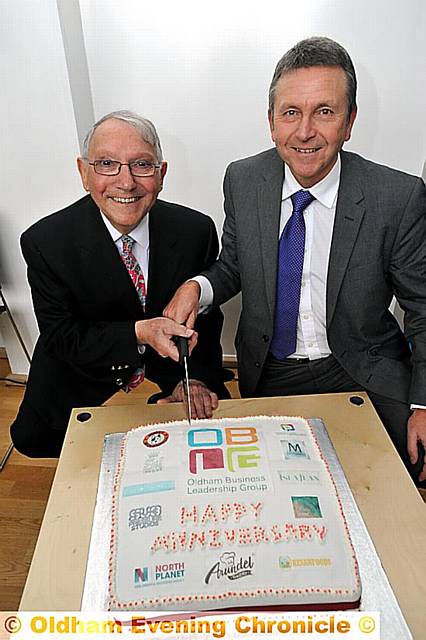 First anniversary celebrations at MAHDLO for Oldham Enterprise Fund. Norman Stoller and Dave Benstead (OBLG Chair).
