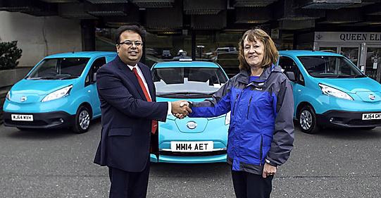 Councillor Barbara Brownridge receives Oldham Council's new e-NV200s from Urfi Hossain of West Way Nissan.