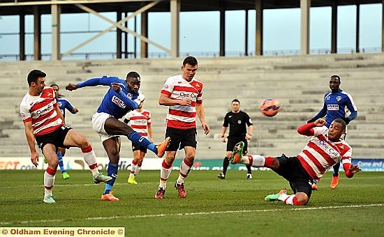 Jabo Ibehre takes aim at the Rovers goal.