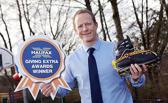 AND the winner is . . . St Joseph’s deputy head Stephen Hill celebrates winning the local Halifax Giving Extra award. PIcture: onEdition 
