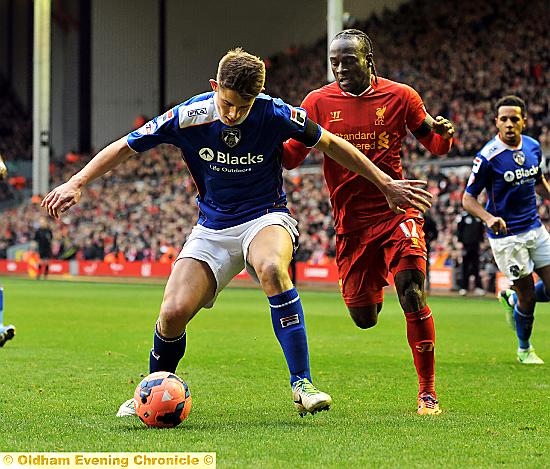DEFENDER James Tarkowski shields the ball from Liverpool forward Victor Moses. 