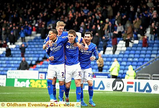 BROTHERS IN ARMS . . . Athletic scorer Danny Philliskirk (second right) is mobbed by Connor Brown, Jon Stead and David Worrall. 