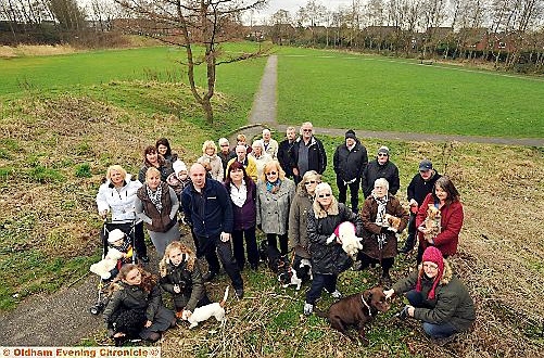 PROTEST . . . Shaw and Crompton Parish Council chairman Dave Murphy and Councillor Diane Williamson, front centre with local residents fighting to save their green space 