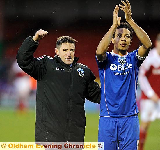 BOSS Lee Johnson and skipper Korey Smith celebrate in front of the Athletic fans after Saturday’s win at Swindon. Smith was the subject of two bids on transfer deadline day. 
