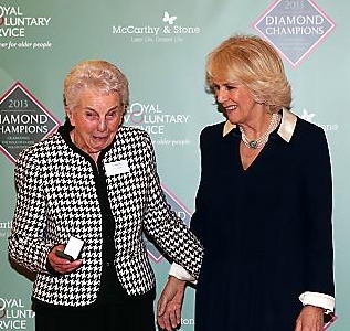 DIAMOND Champion . . . Doreen Smith receives her pin from the duchess 
