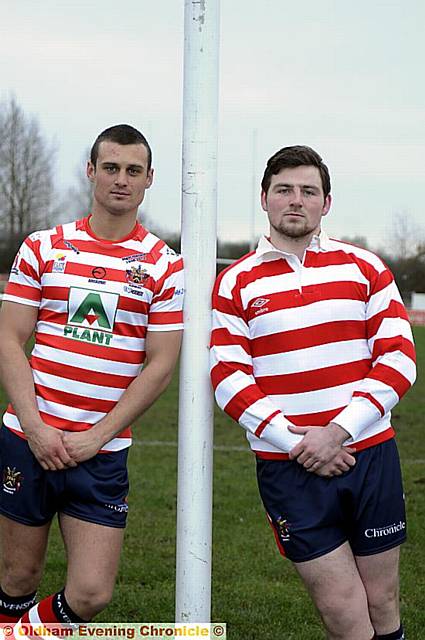 Old and new: skipper Lewis Palfrey (left) shows off the Oldham RL kit for this season — and Michael Ward shows off the more familiar shirt of past Oldham sides 