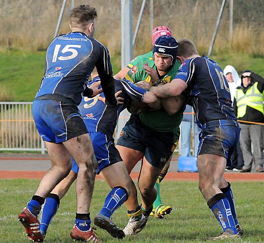 Oldham’s Mark Hobson tries to punch a hole in the Egremont line. 