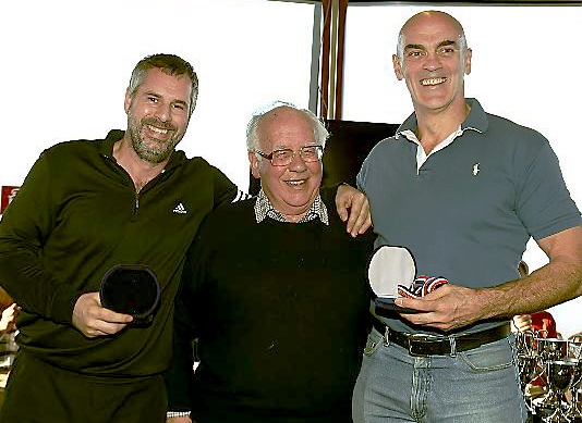 Winners: Neal (right) and team mate Gary Smith (left) collect their medals from Robin Dixon, part of the team that won Britain’s only ever bobsleigh Olympic gold medal 
