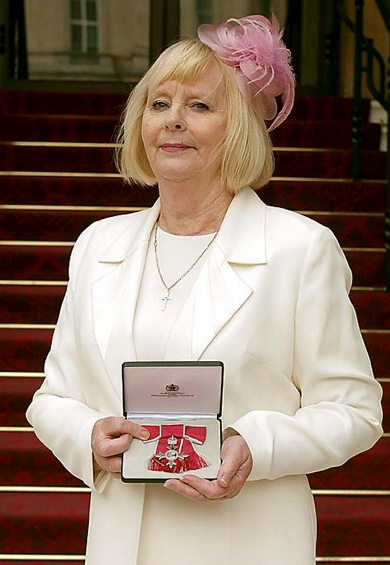 HONOUR . . . Angela receives her MBE at Buckingham Palace 

