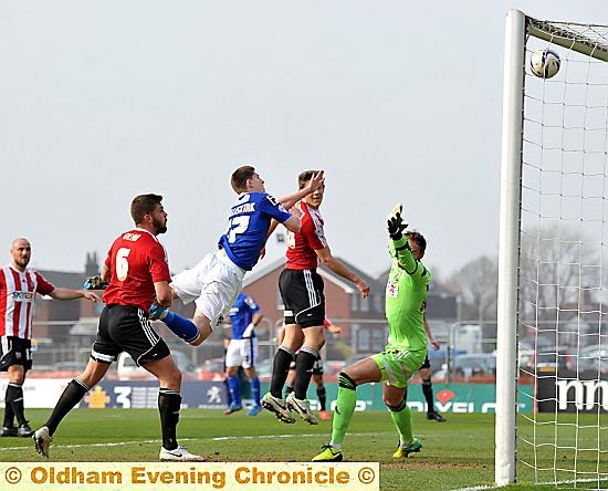 WAS HE PUSHED? Danny Philliskirk certainly thought so as his header from close range misses the target. 