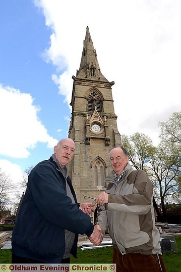 THANK-YOU very much . . . church warden Roy Pollitt (left) receives the clock tower keys from architect Andrew Kepczyk 
