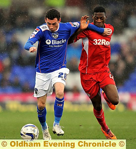 BATTLING: David Worrall holds off a Crawley defender. 
