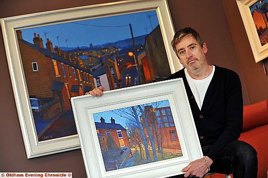 Chris with paintings from his street-light series 
