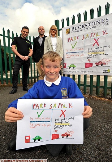 SAFETY check . . . Will Collinge with his original artwork used in the new safety banner. Standing behind are Chris Gledhill (left), from Sign UK Ltd, and school governors James Woodward and Sarah Parker 