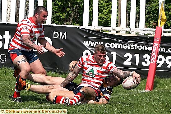 FLOORED: a York City Knights opponent is unable to prevent Oldham’s Dale Bloomfield from touching down. 