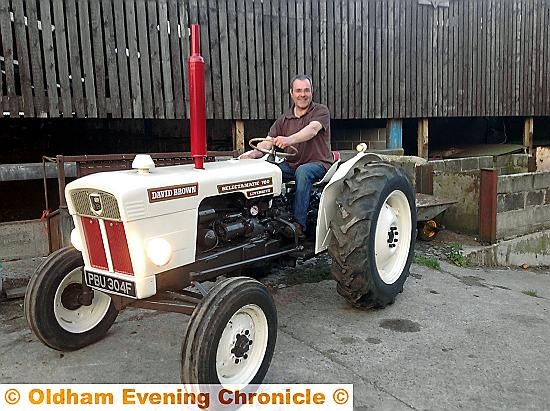 IN the driving seat: Royton farmer Philip Day is embarking on a four-day vintage tractor ride for charity 