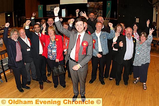 WE did it . . . Council leader Jim McMahon celebrates with his Labour colleagues