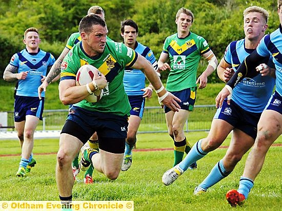ON THE RUN: Oldham full-back Steven Nield takes on the All Golds defence 