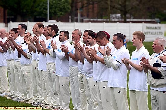 A BIG hand for Trevor: players take part in a minute’s applause at the charity match 