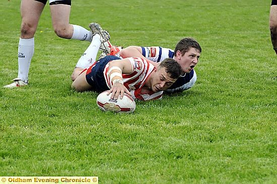 TOUCHDOWN . . . Danny Whitmore scores Oldham’s second try in the 12th minute