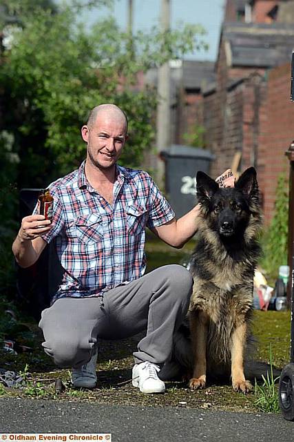 John Badby and his dog Mazie, who was injured by broken glass.