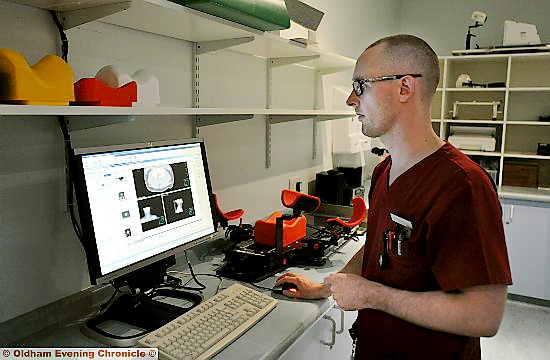 Therapy radiographer Wesley Doherty keeps a close watch on his monitor