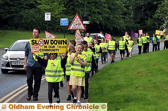 WALKING bus ... Pupils from St Edwards RC Primary School, Lees, raise awareness of road safety.