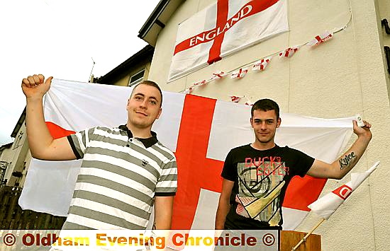 Jamie Robinson and Ryan McCallion fly the flags in Delph Lane, Delph.
