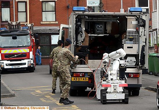 Bomb disposal experts prepare to check out the find