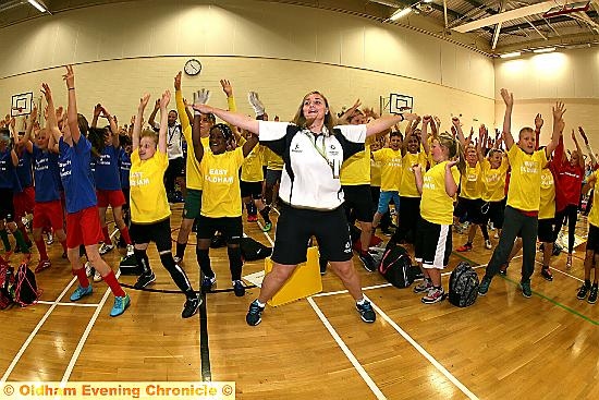 ARMS in the air . . . Leanne Whitehead, an activity development worker with Oldham Council, takes a warm-up session 