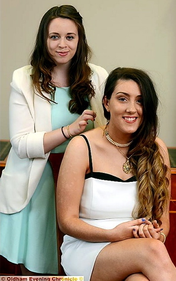 OUTGOING mayor Emma O'Donnell hands over her chain of office to successor Daisy Murphy 

