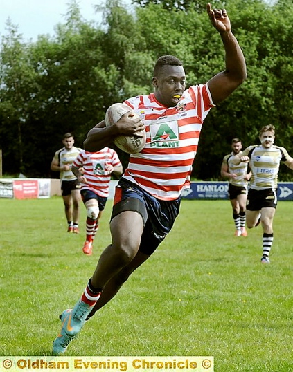 MO'S THE MAN: Oldham winger Mo Agoro crosses the line for another try