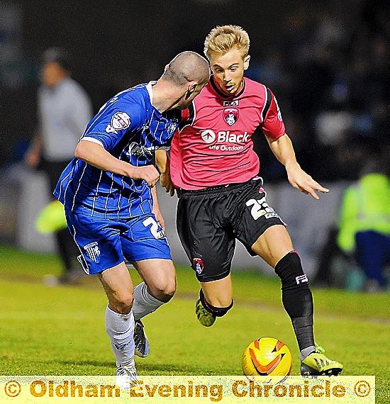 Mills in action against Gillingham last November