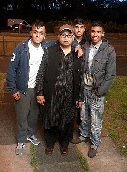 Junaid Khan’s father Mumtaz Khan (father) with friends at the vigil.