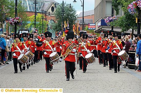 STRIKE up the band . . . the procession through Oldham town centre